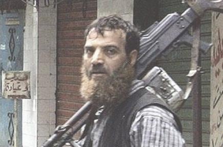 (صورة أرشيفية لمقاتل من فتح الإسلام خلال وجوده في مخيم نهر البارد)