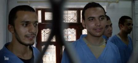 المتهمون الأربعة في المحكمة أمس