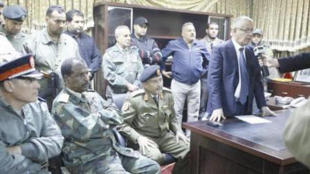 رئيس الوزراء الليبي خلال اعلانه اخلاء مدينة بنغازي من المجموعات المسلحة